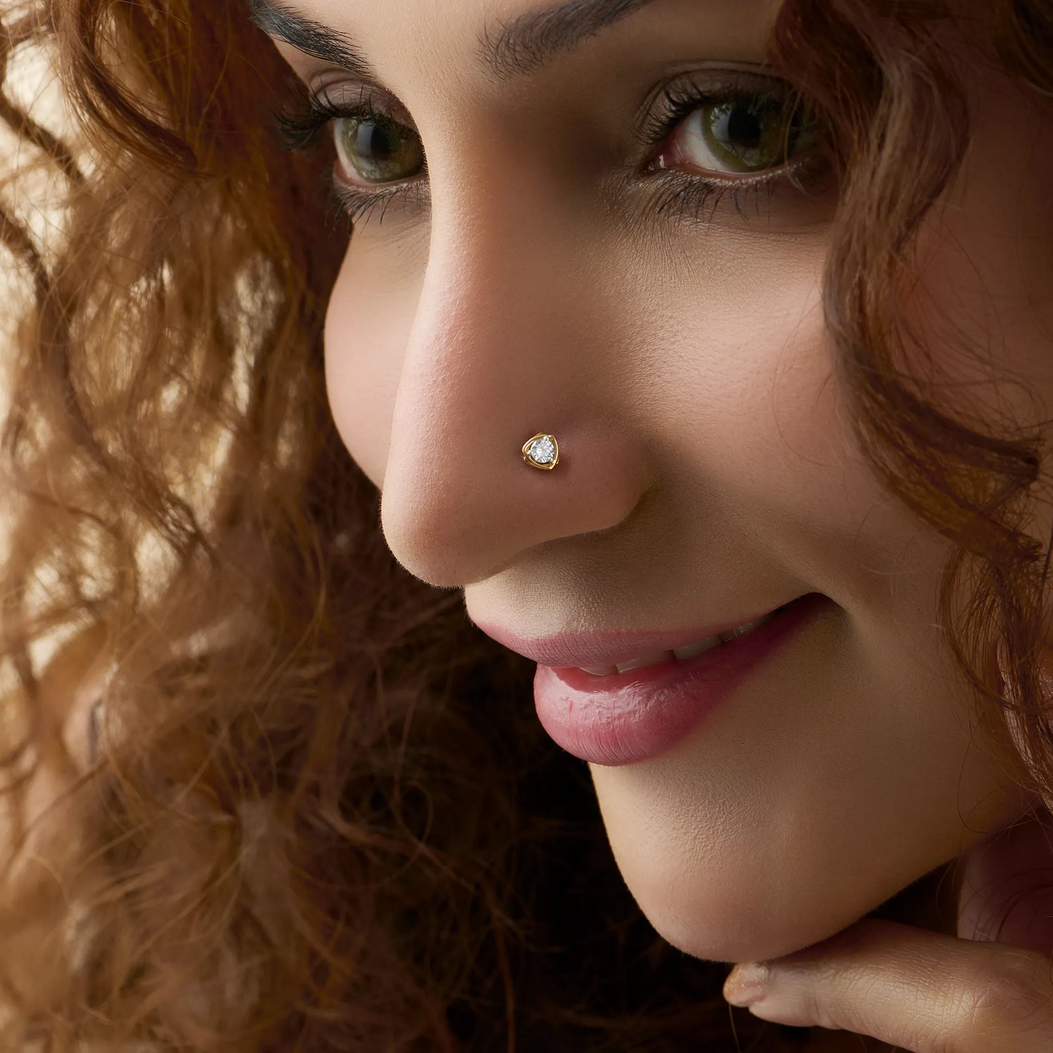 Regal Glow Single Solitaire Diamond And Gold Nose Pin For Women