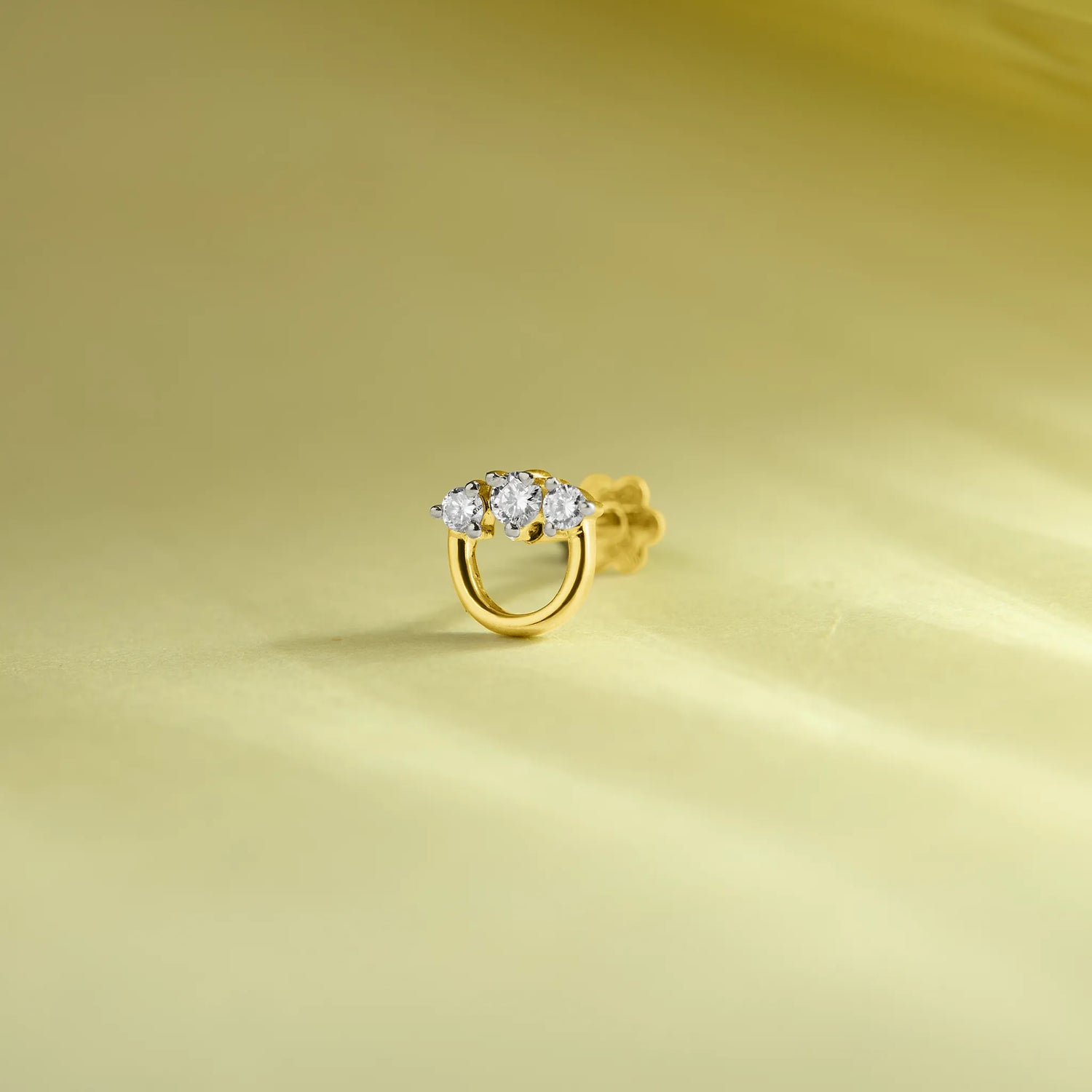 Circular Brilliance Semi Circular Diamond And Gold Nose Pin Design