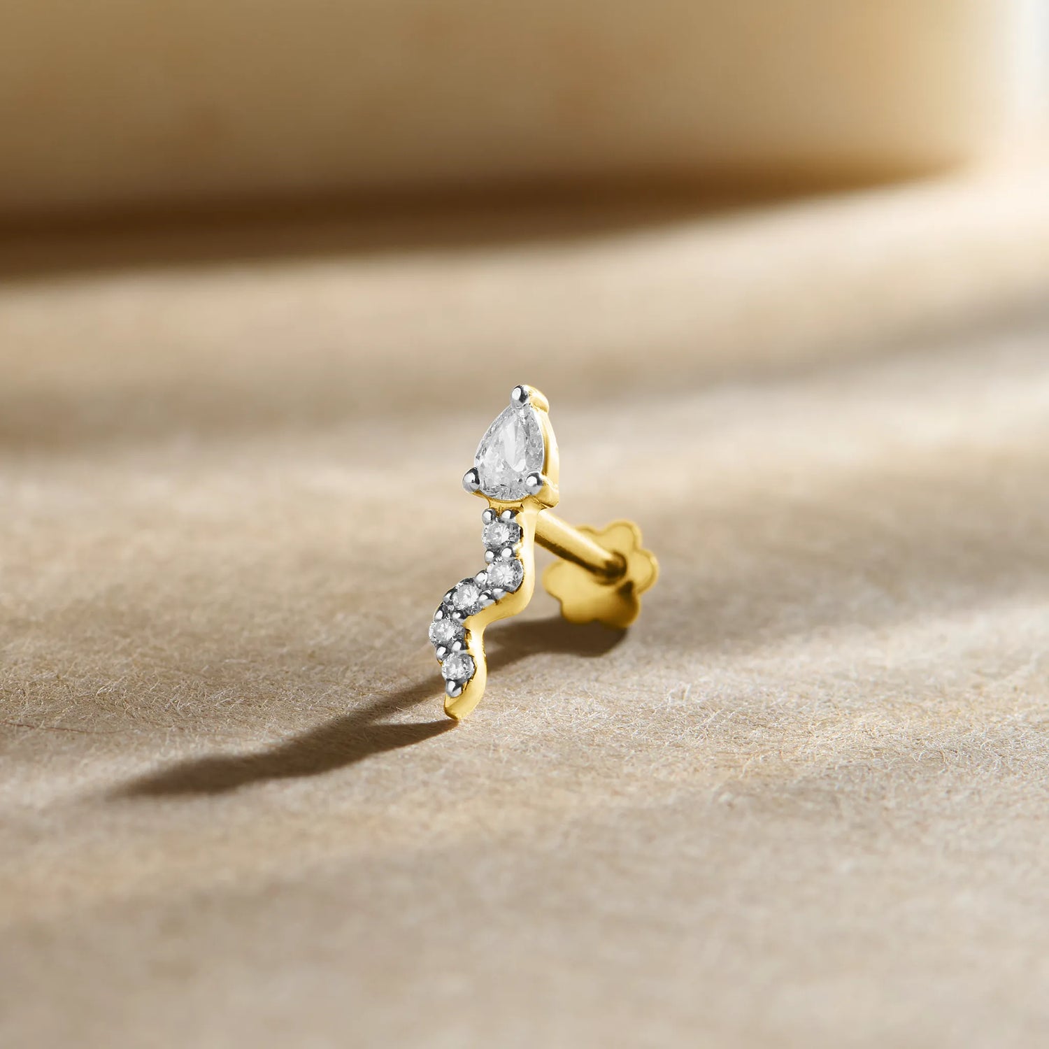 Premium lab grown diamond nose pin in real gold with modern curved design, lightweight everyday diamond nose ring for women, BIS hallmarked 14K gold nose jewellery with certified IGI lab diamonds by Yuvora, elegant minimal nose pin for daily wear, gifting, bridal and contemporary Indian styling.