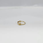 Side angle view of a delicate gold nose ring on a white background emphasizing its slim lightweight design