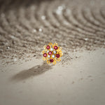 Nose pin new design gold with multicolor floral stones on textured surface