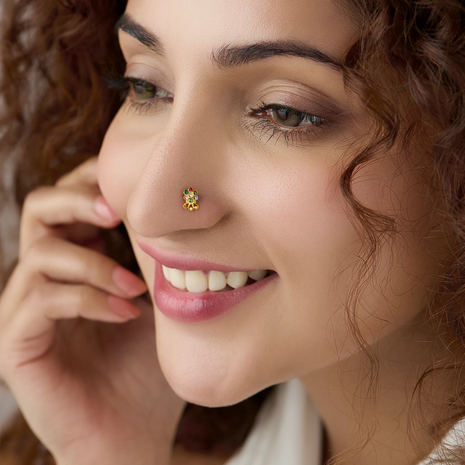 Woman wearing lab grown diamond nose pin with floral design close up