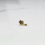 Stone gold nose pin minimal floral style close up