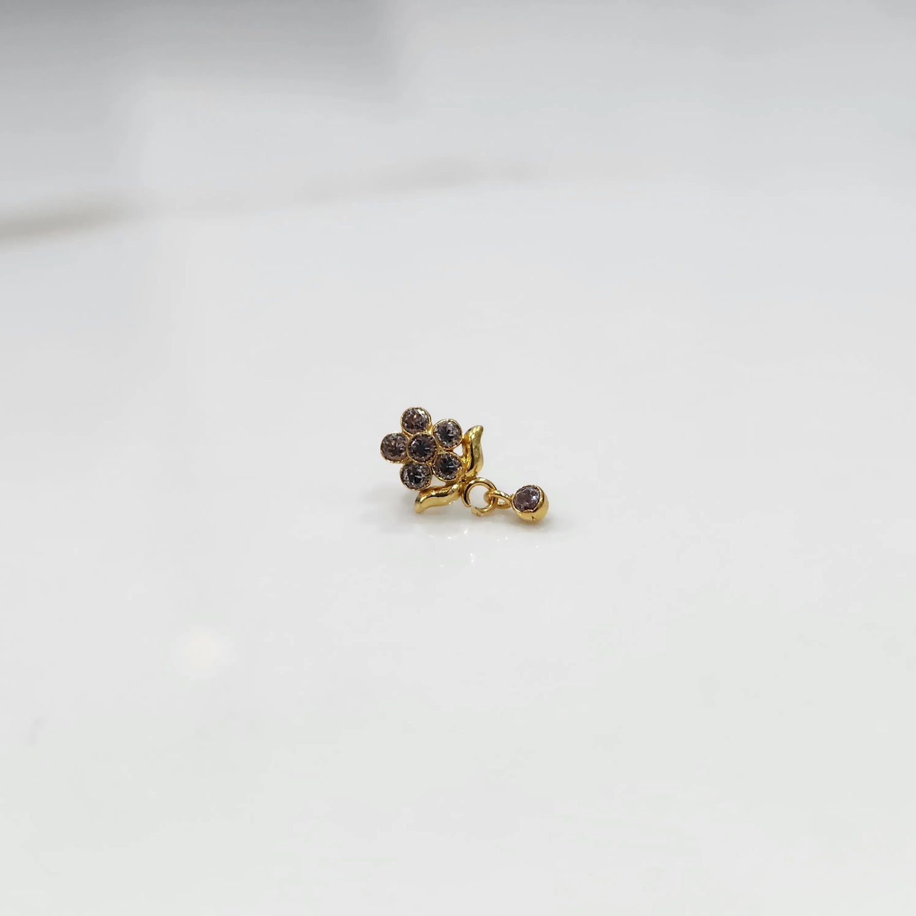Stone gold nose pin minimal floral style close up