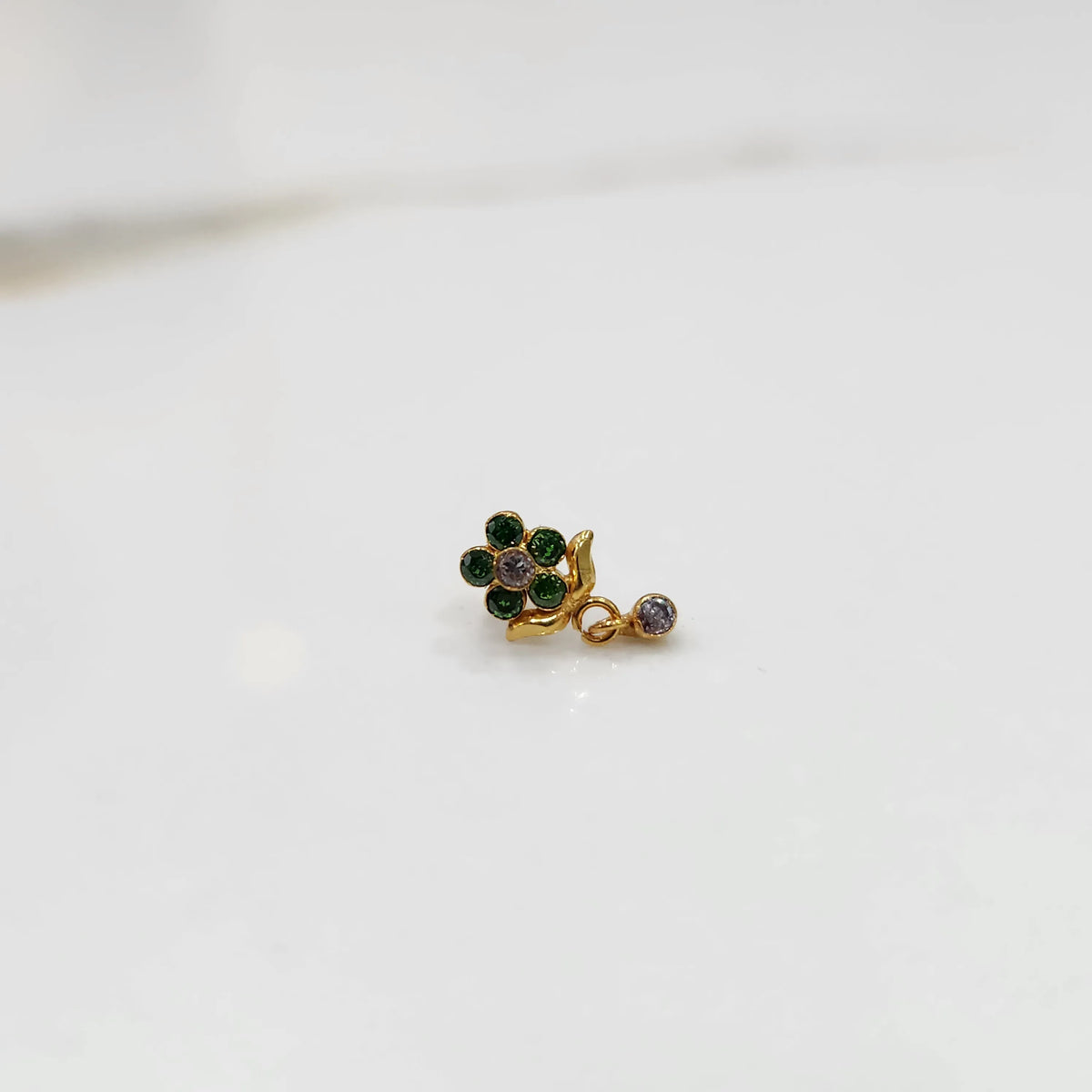 Stone gold nose pin minimal floral style close up