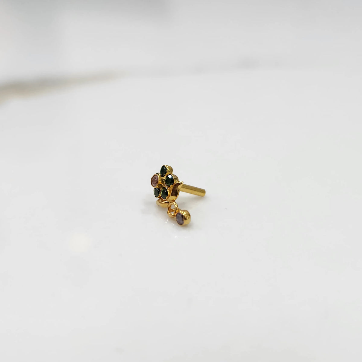 Stone gold nose pin minimal floral style close up