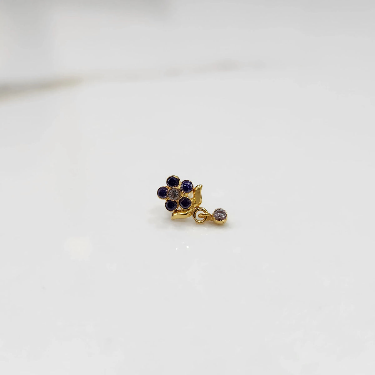 Stone gold nose pin minimal floral style close up