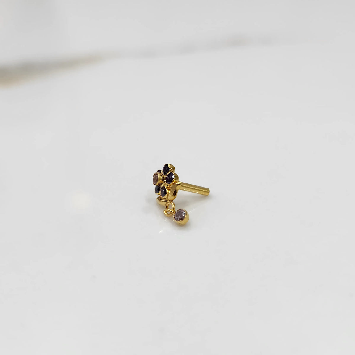 Stone gold nose pin minimal floral style close up