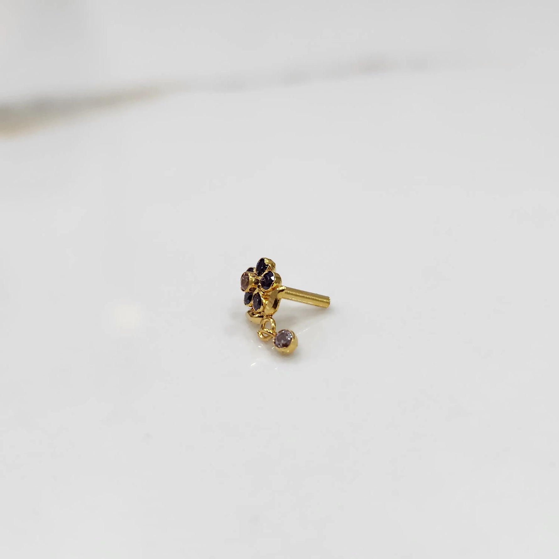 Stone gold nose pin minimal floral style close up