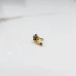 Stone gold nose pin minimal floral style close up