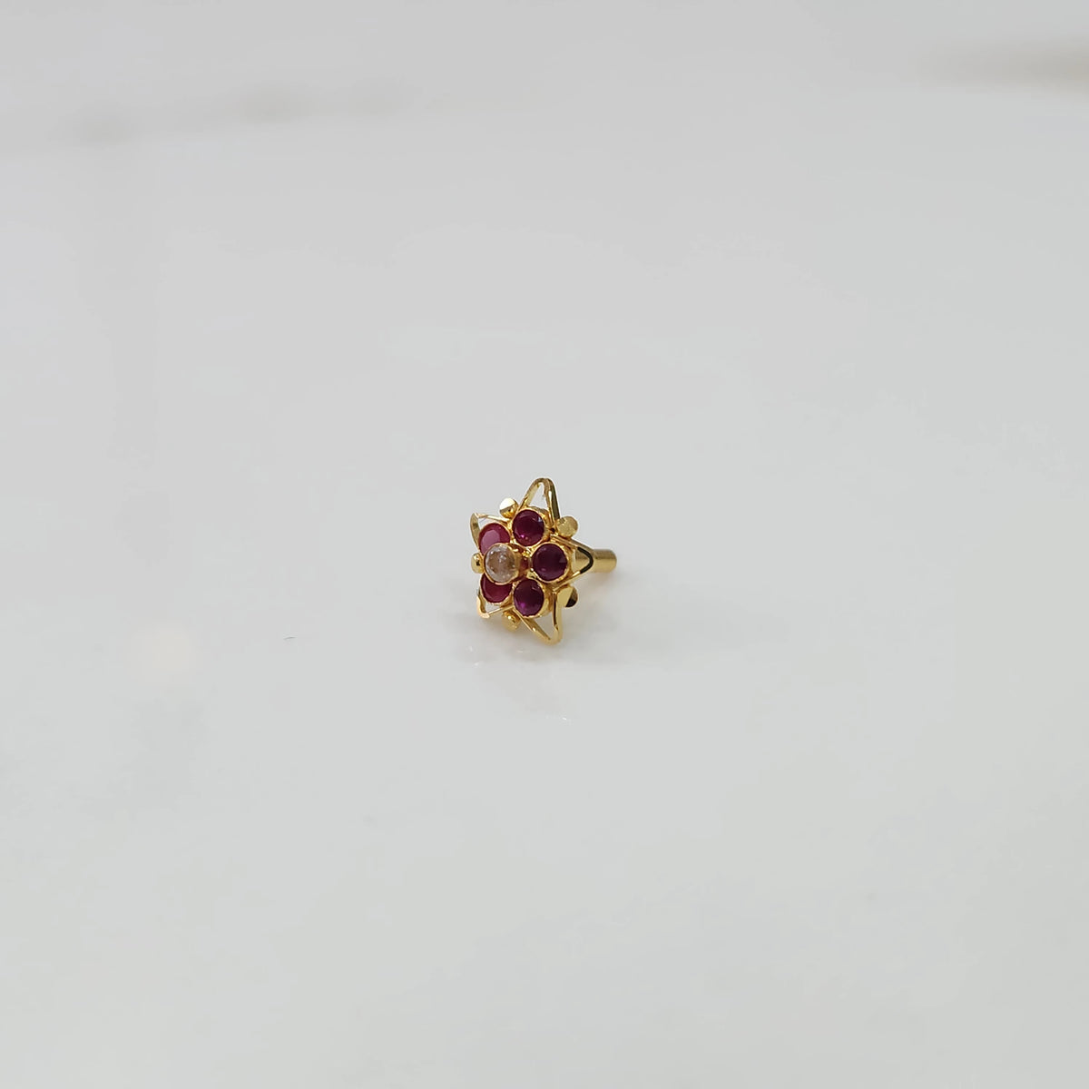 Nose pin design gold with small gemstone cluster elegant style