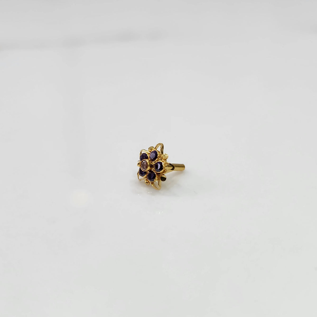 Nose pin design gold with simple floral gemstone design minimal look