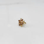 Woman wearing elegant stone gold nose pin with minimal look