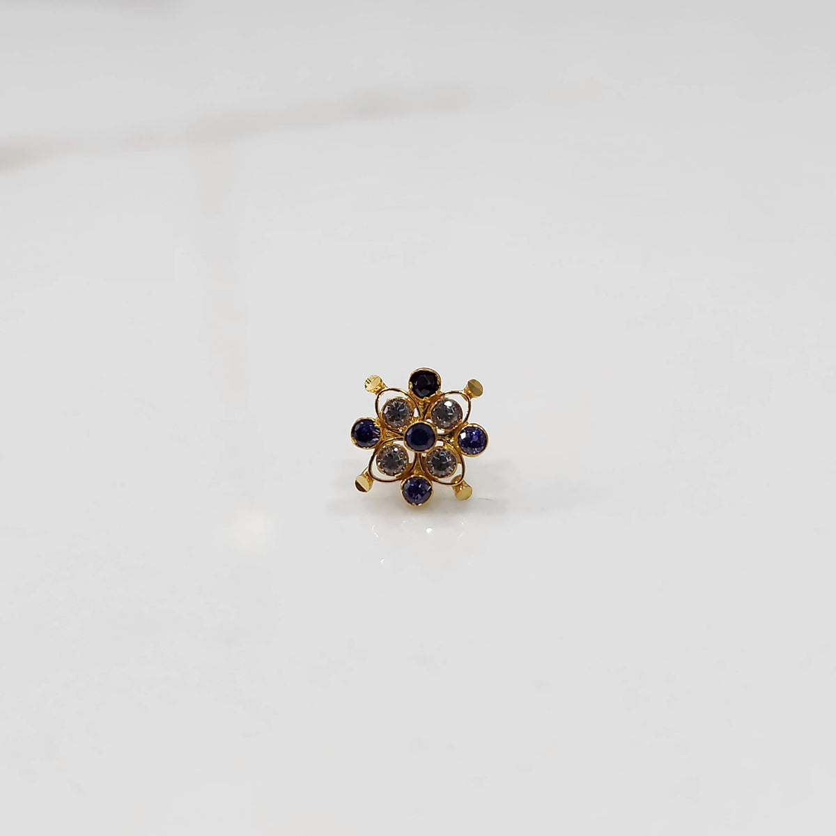 Stone gold nose pin close up with sparkling stones