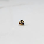 Tiny nose pin gold with compact floral diamond arrangement