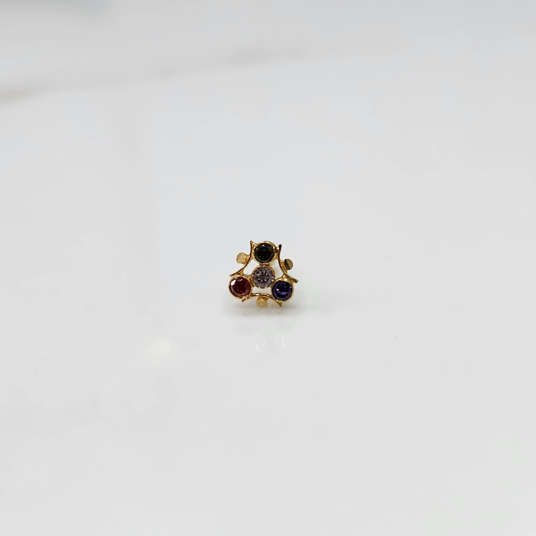 Tiny nose pin gold with compact floral diamond arrangement