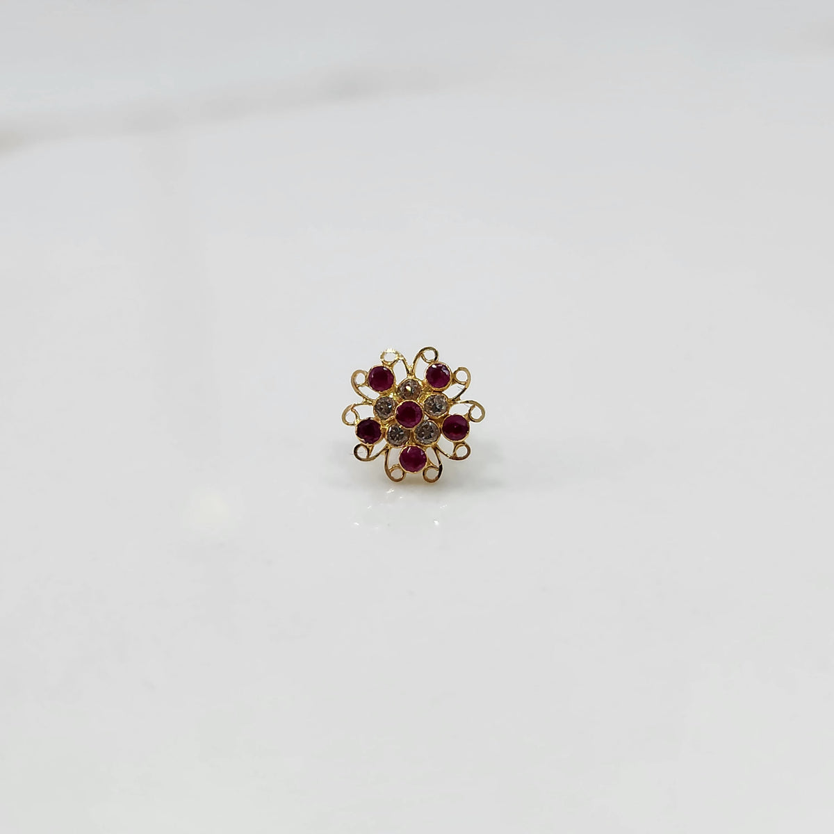 Nose pin new design gold with multicolor floral cluster on white background