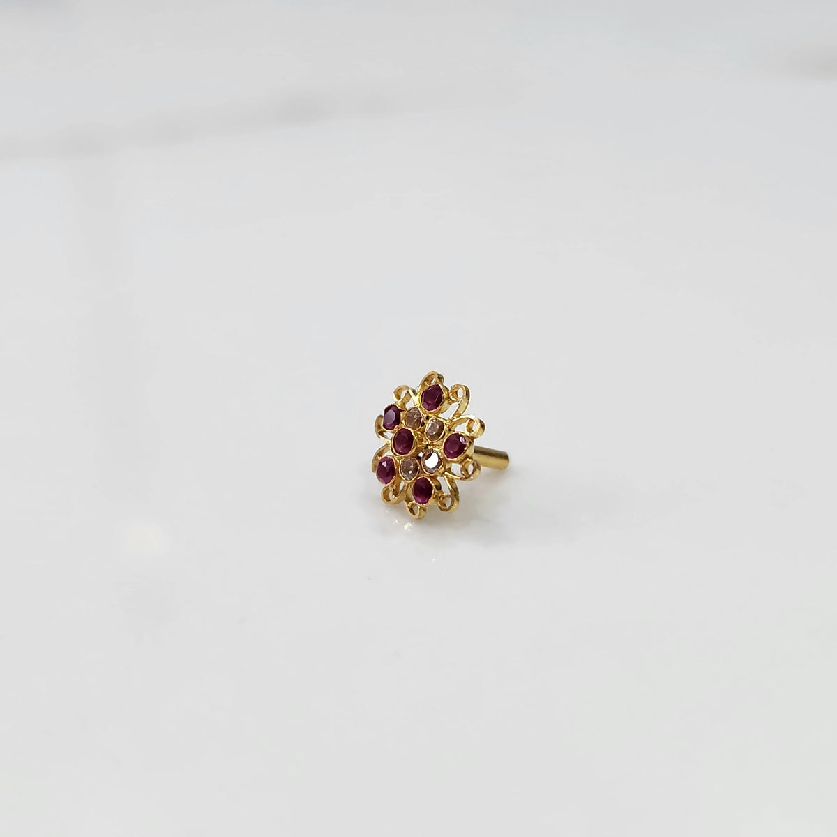 Nose pin new design gold with multicolor floral cluster on white background