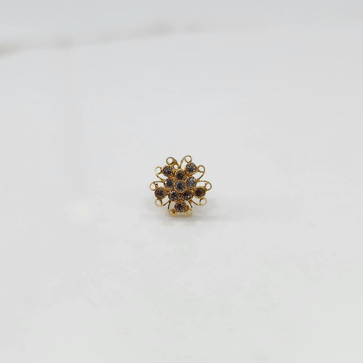 Nose pin new design gold with compact floral gemstone setting
