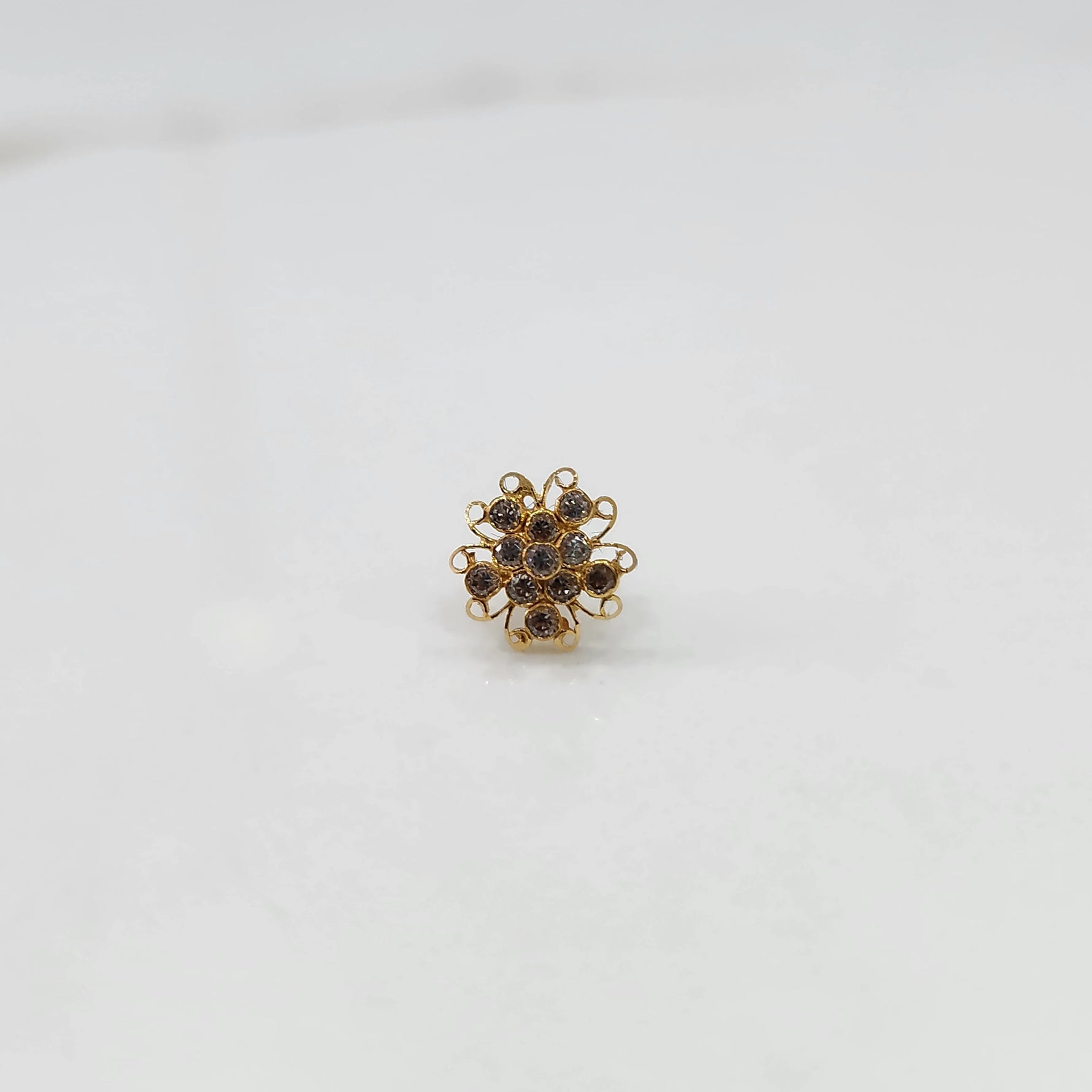 Nose pin new design gold with compact floral gemstone setting