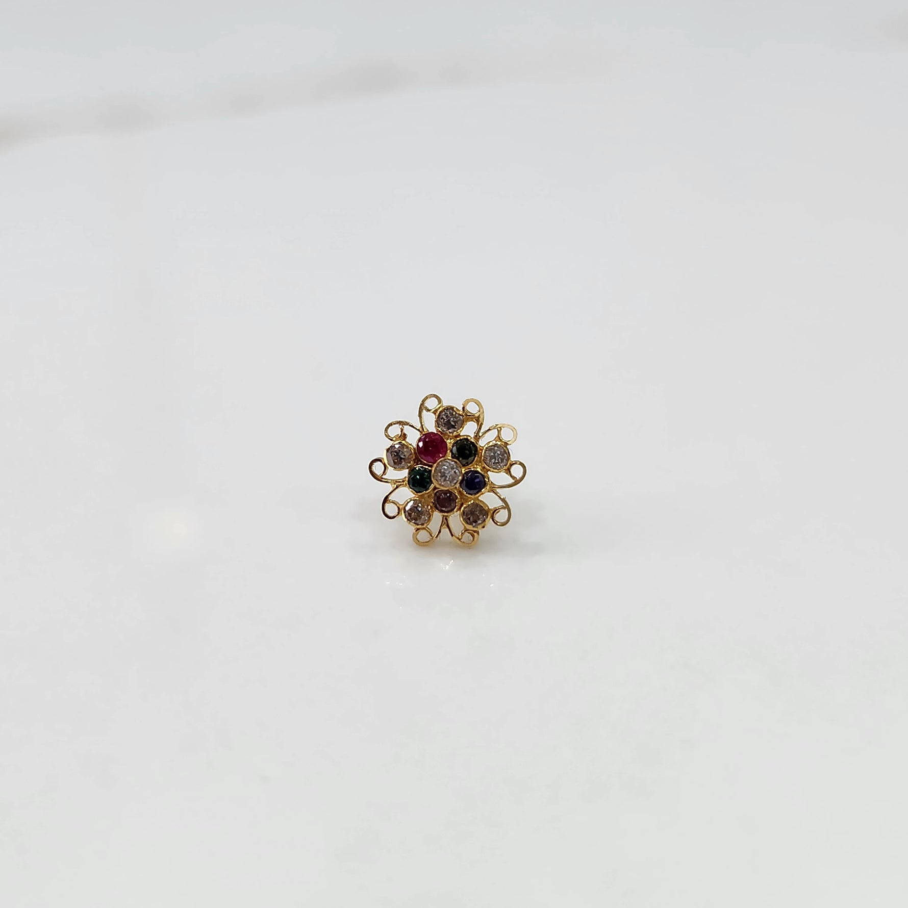 Nose pin new design gold with elegant floral cluster angled view