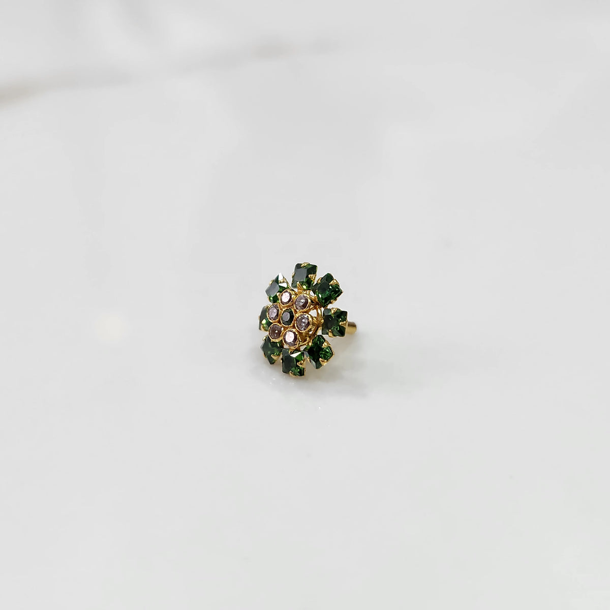 Minimal gold nose pin design with small floral stones