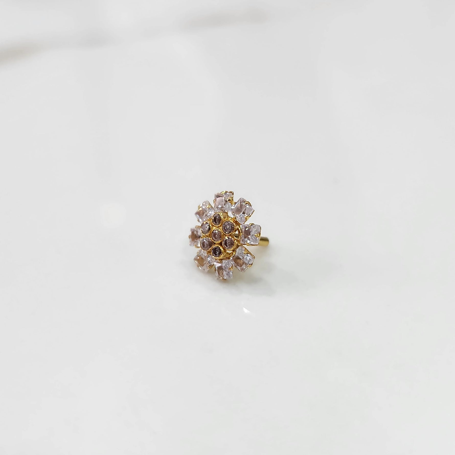 Gold nose pin design with intricate multicolor floral detailing