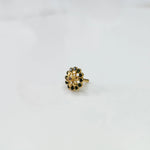 Minimal gold nose pin design with small floral pattern