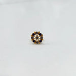 Gold pin nose with multicolor floral cluster on white background