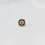 Gold pin nose with elegant floral cluster on white background