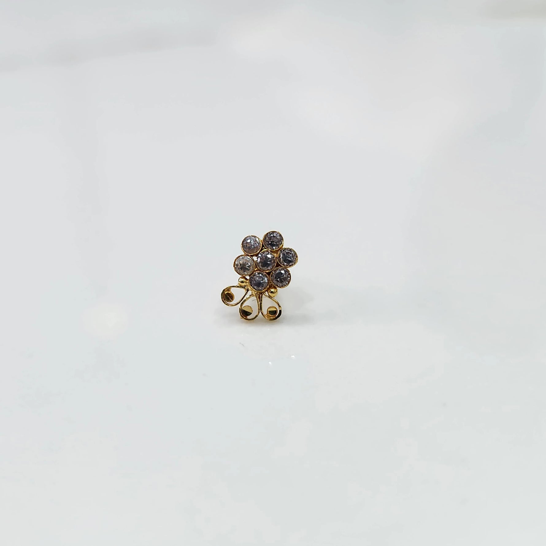 Close up lab grown diamond nose pin with multicolor floral setting