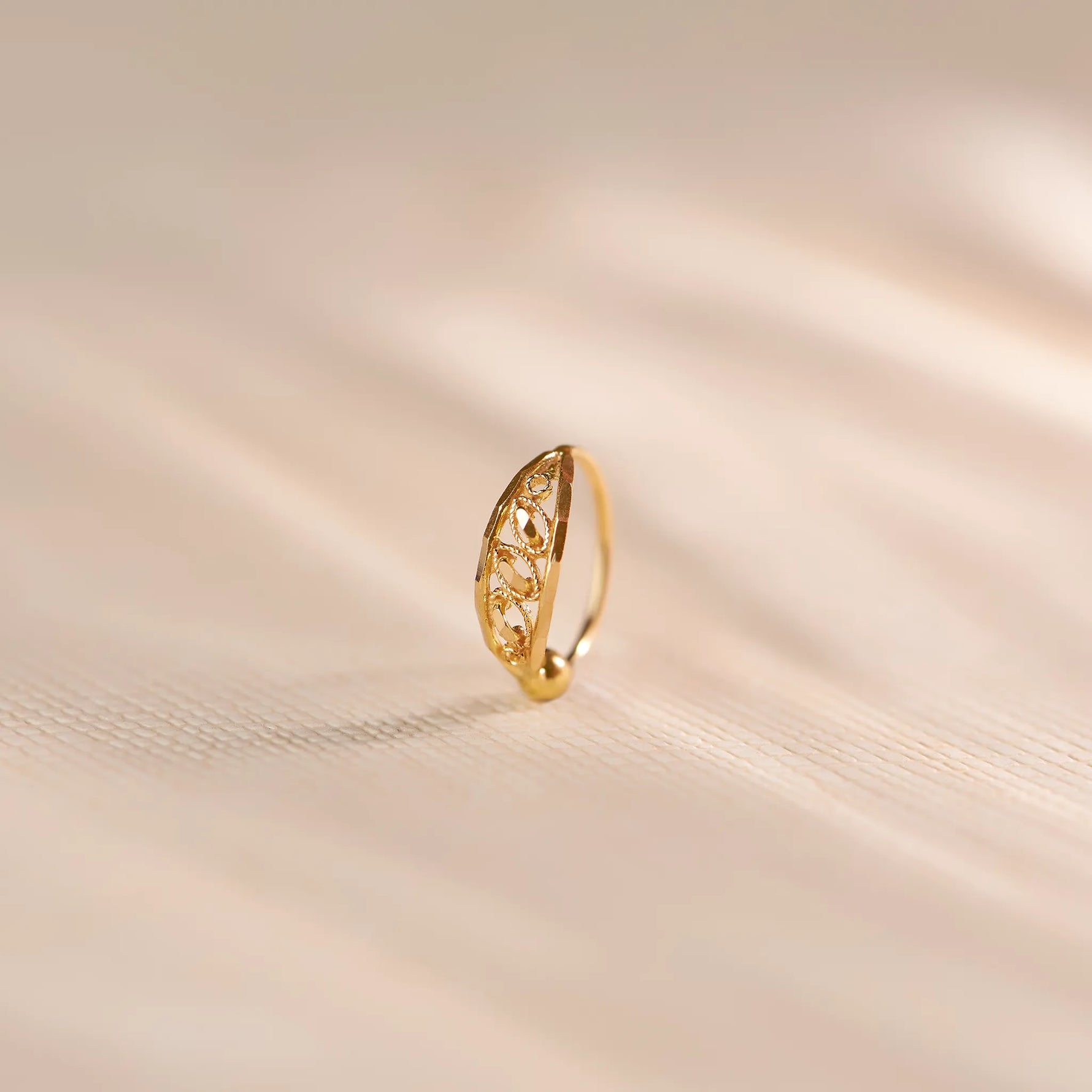Elegant real gold nose ring with delicate filigree design, lightweight everyday gold nose ring for women, BIS hallmarked 18k gold nose jewellery by Yuvora, minimal traditional Indian nose pin perfect for daily wear, gifting, bridal and modern ethnic styling.