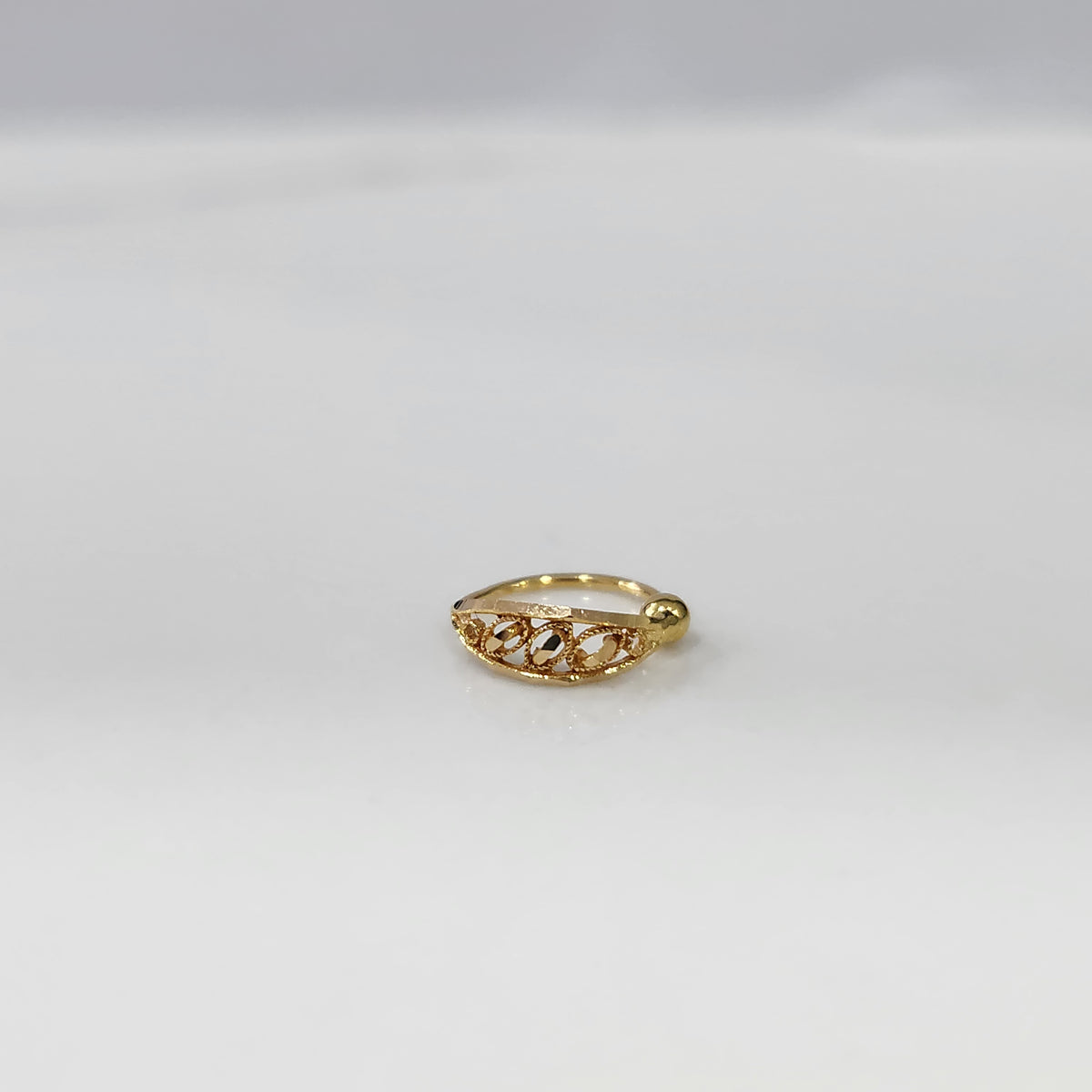 Allure Twist Gold Nose Ring by Yuvora in 18K gold with elegant vine-inspired twist design displayed on white background