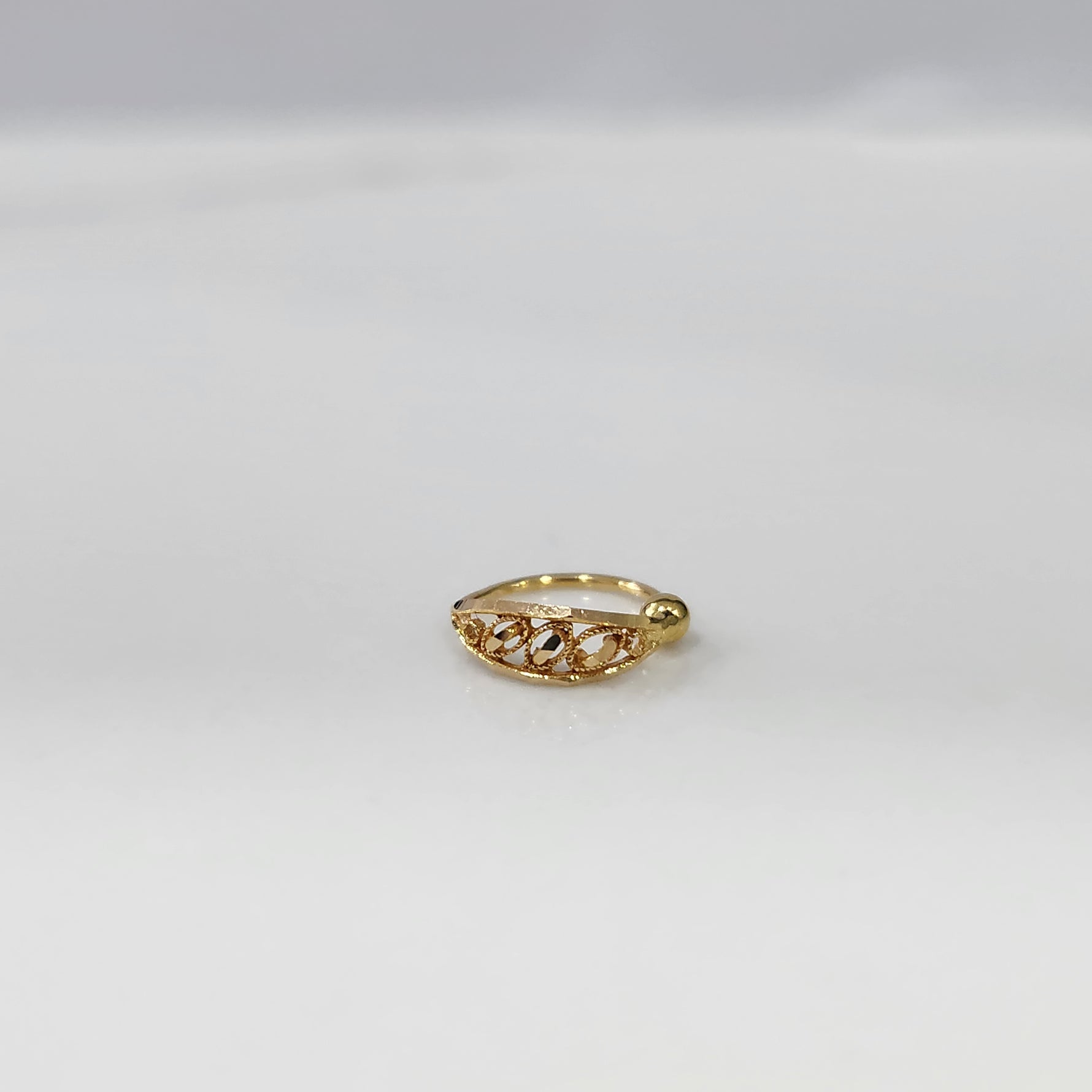 Allure Twist Gold Nose Ring by Yuvora in 18K gold with elegant vine-inspired twist design displayed on white background