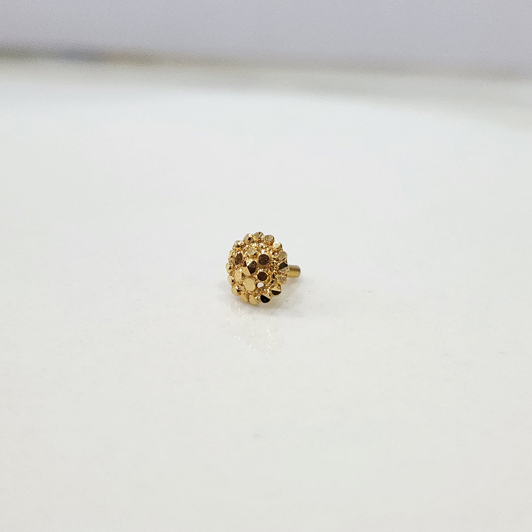 Auric Corona gold nose pin 18K angled view with radiant circular sunrise-inspired design on plain background