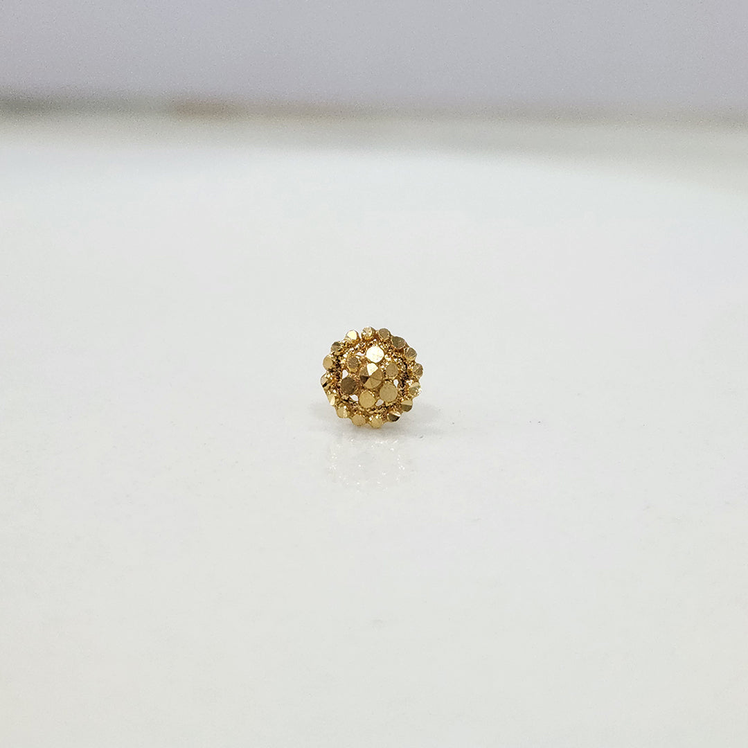 Auric Corona gold nose pin 18K close-up view with radiant circular sunrise-inspired design on plain background