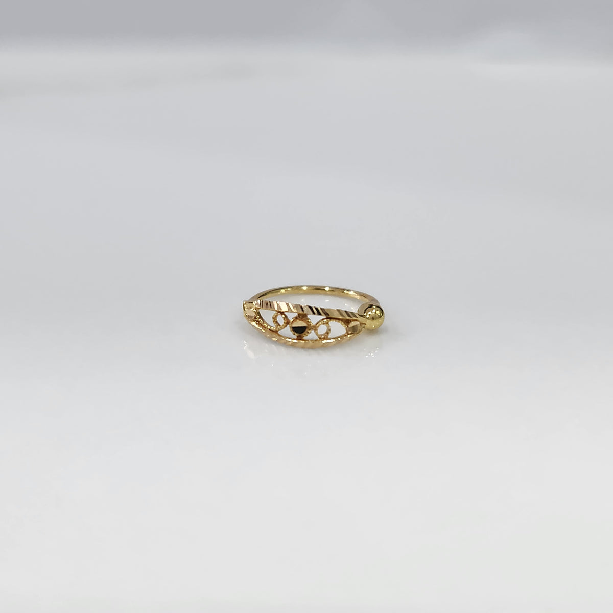 Center Loop Gold Nose Ring crafted in 18K gold with classic loop design placed on a white background