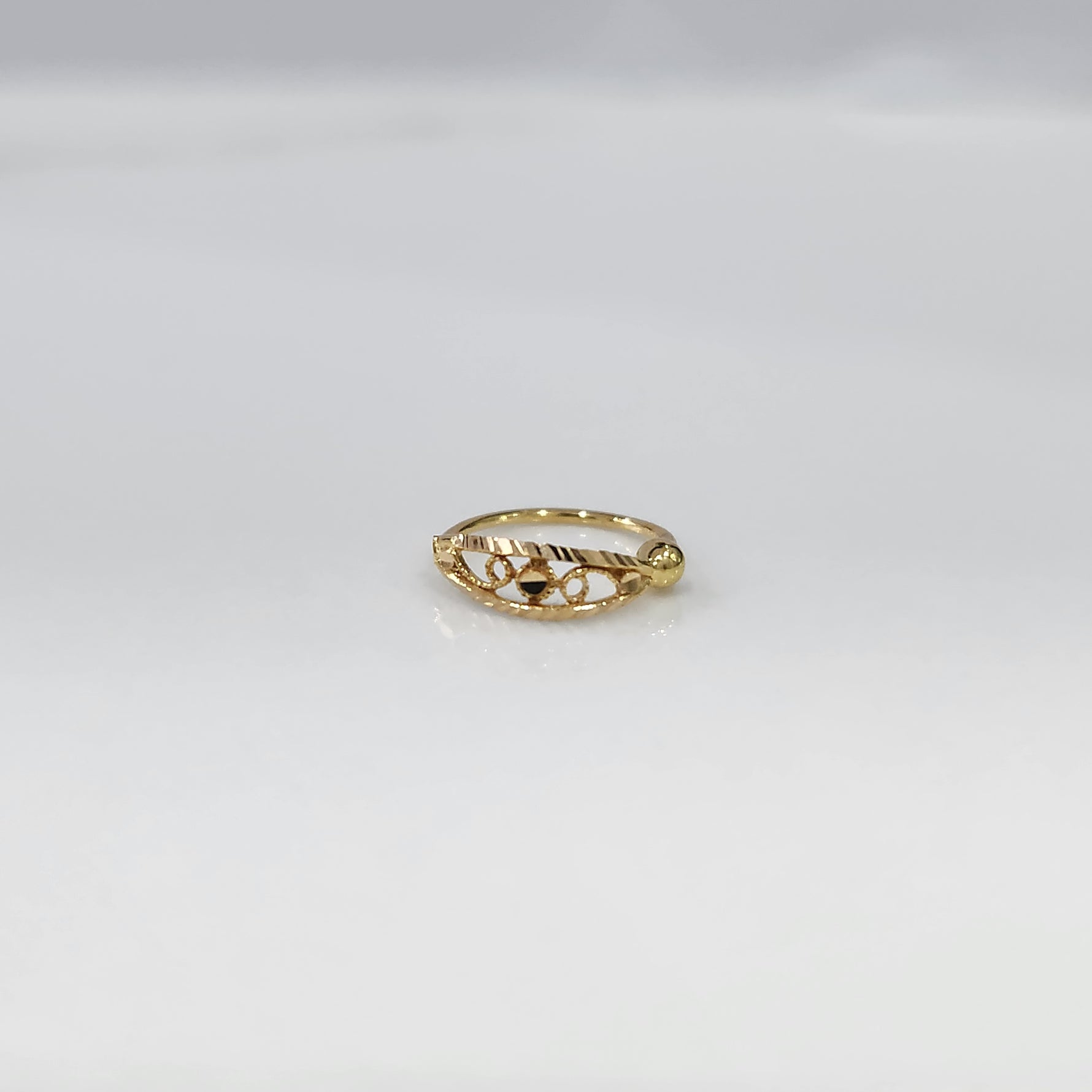 Center Loop Gold Nose Ring crafted in 18K gold with classic loop design placed on a white background