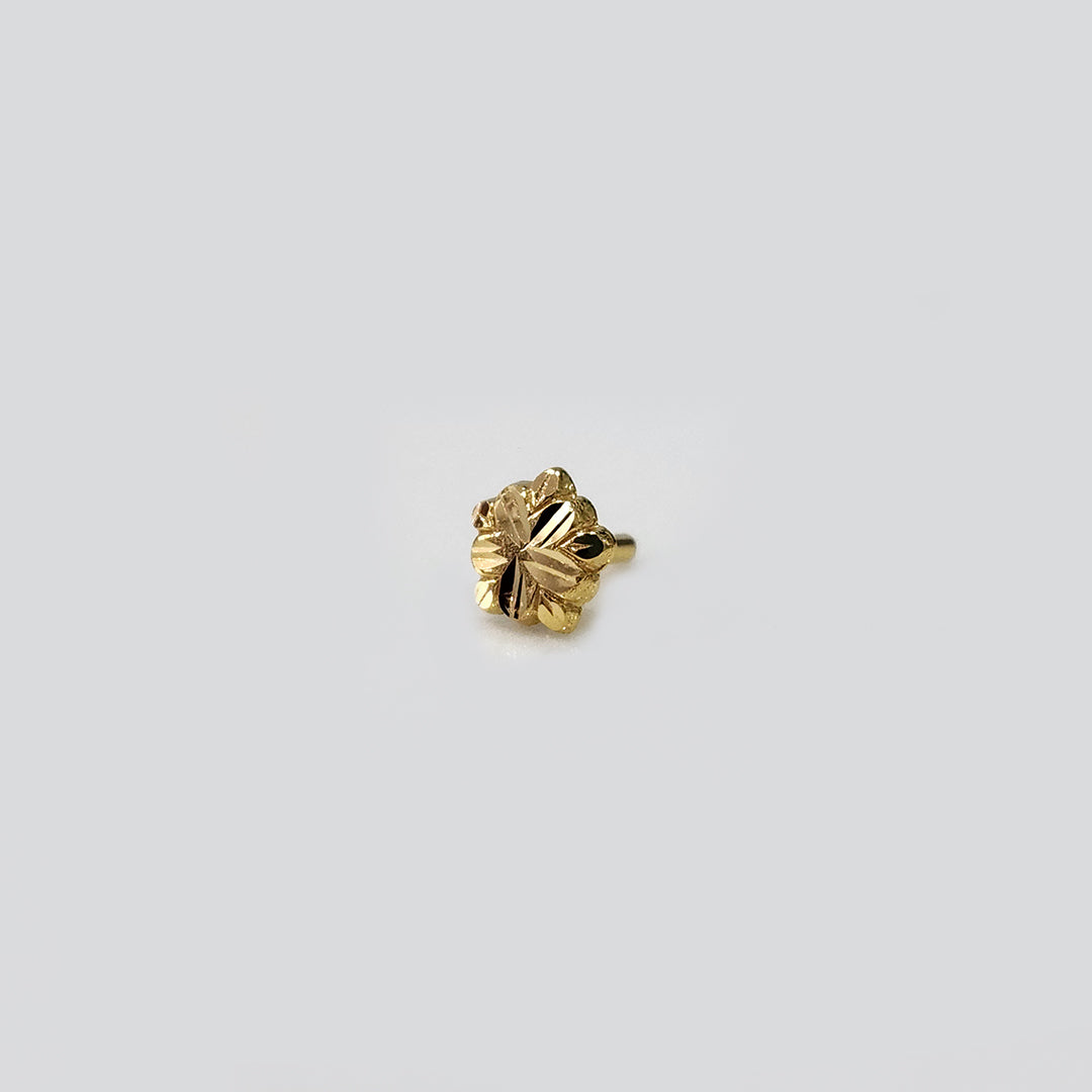 Angled side view of five-petal 18k gold nose pin with detailed floral carving, crafted in lightweight gold for elegant daily wear.