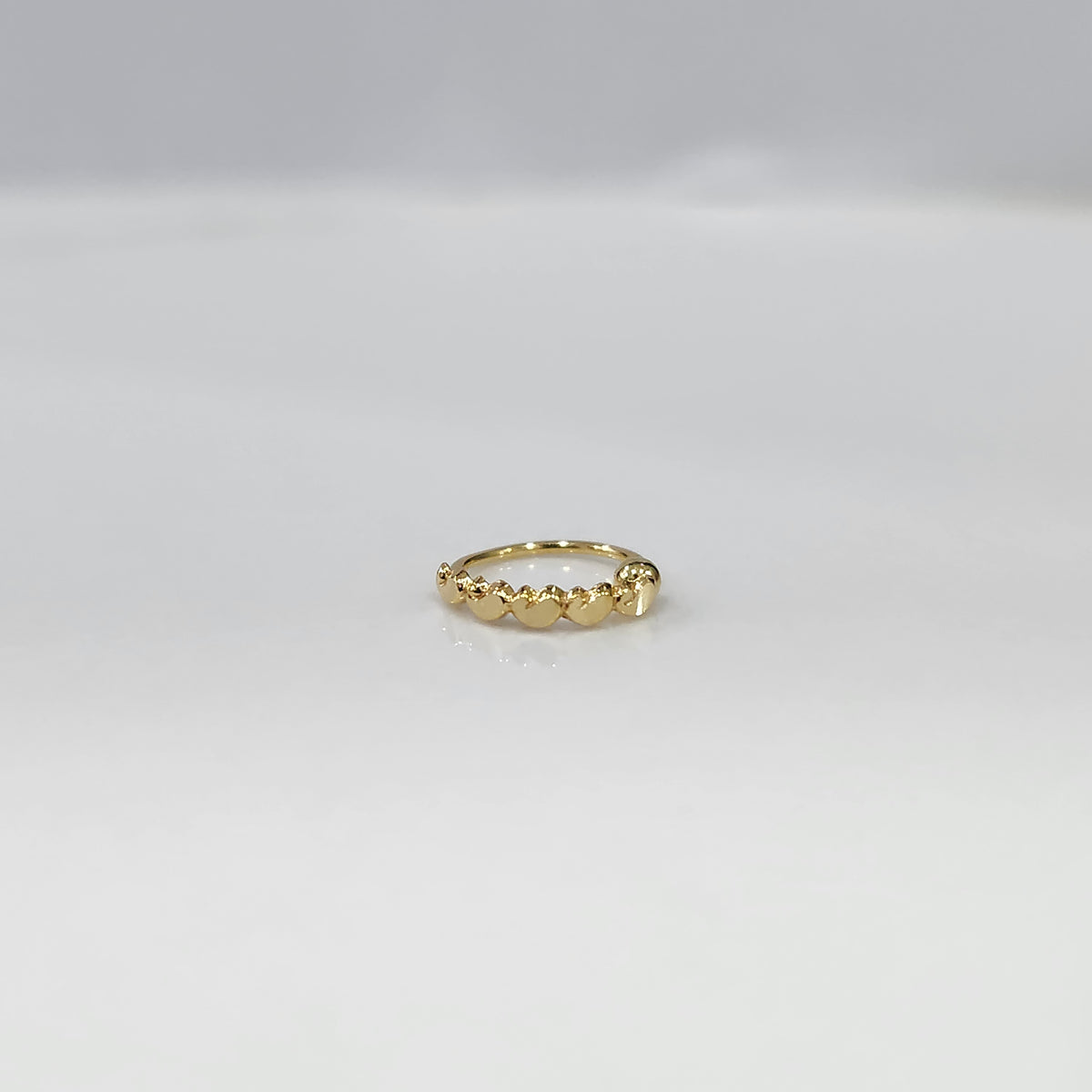 Gold Heart Row gold nose ring with elegant heart pattern design, crafted in 18K gold, displayed on plain background