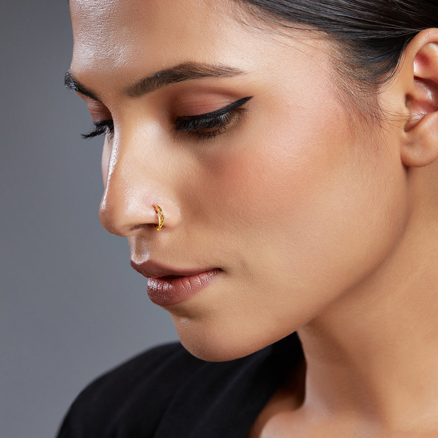 Model wearing Gold Orbit Gold Nose Ring in 18K gold with celestial-inspired design by Yuvora