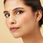 Golden Crescent gold nose pin in 18K, crescent moon design worn by model for elegant daily wear