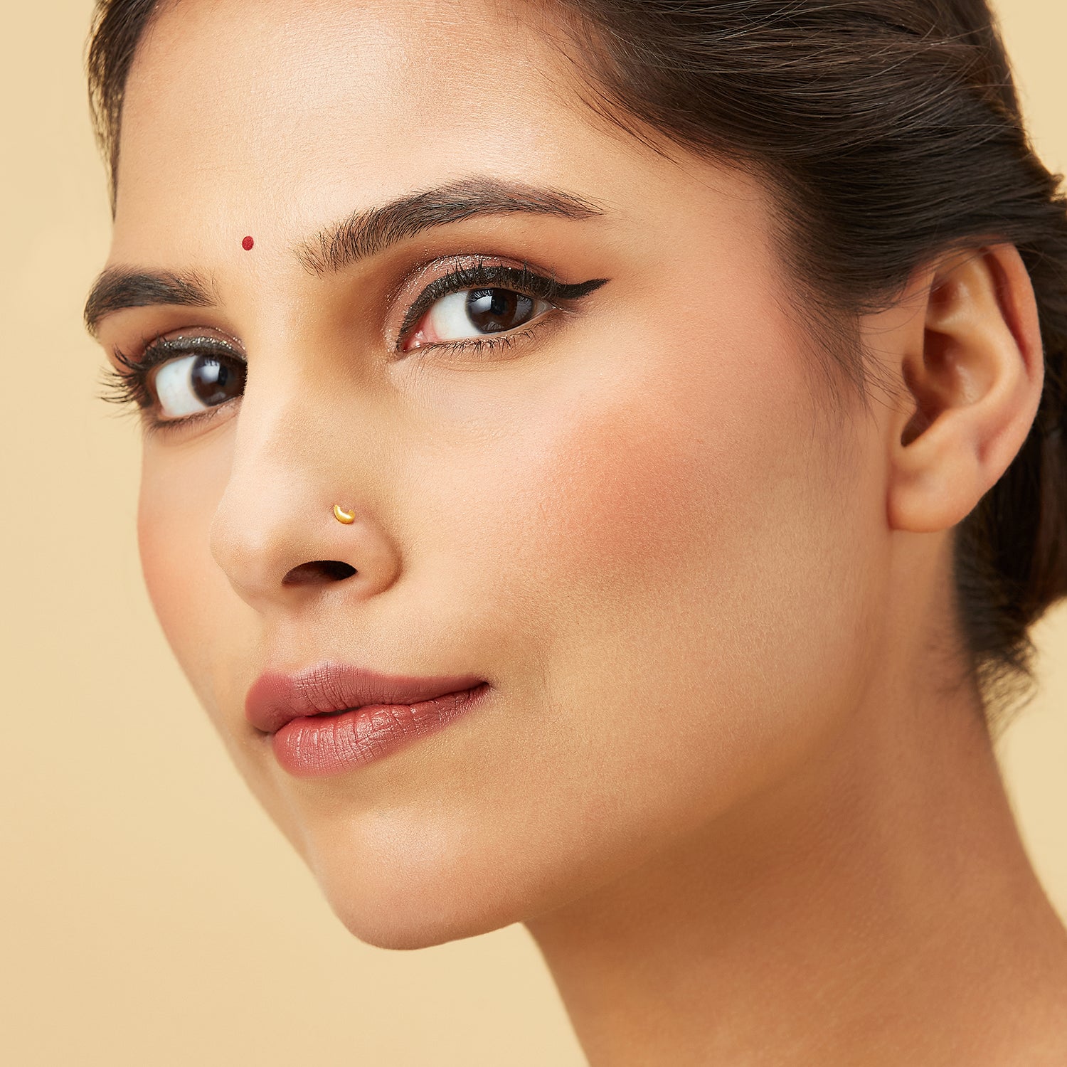 Golden Crescent gold nose pin in 18K, crescent moon design worn by model for elegant daily wear