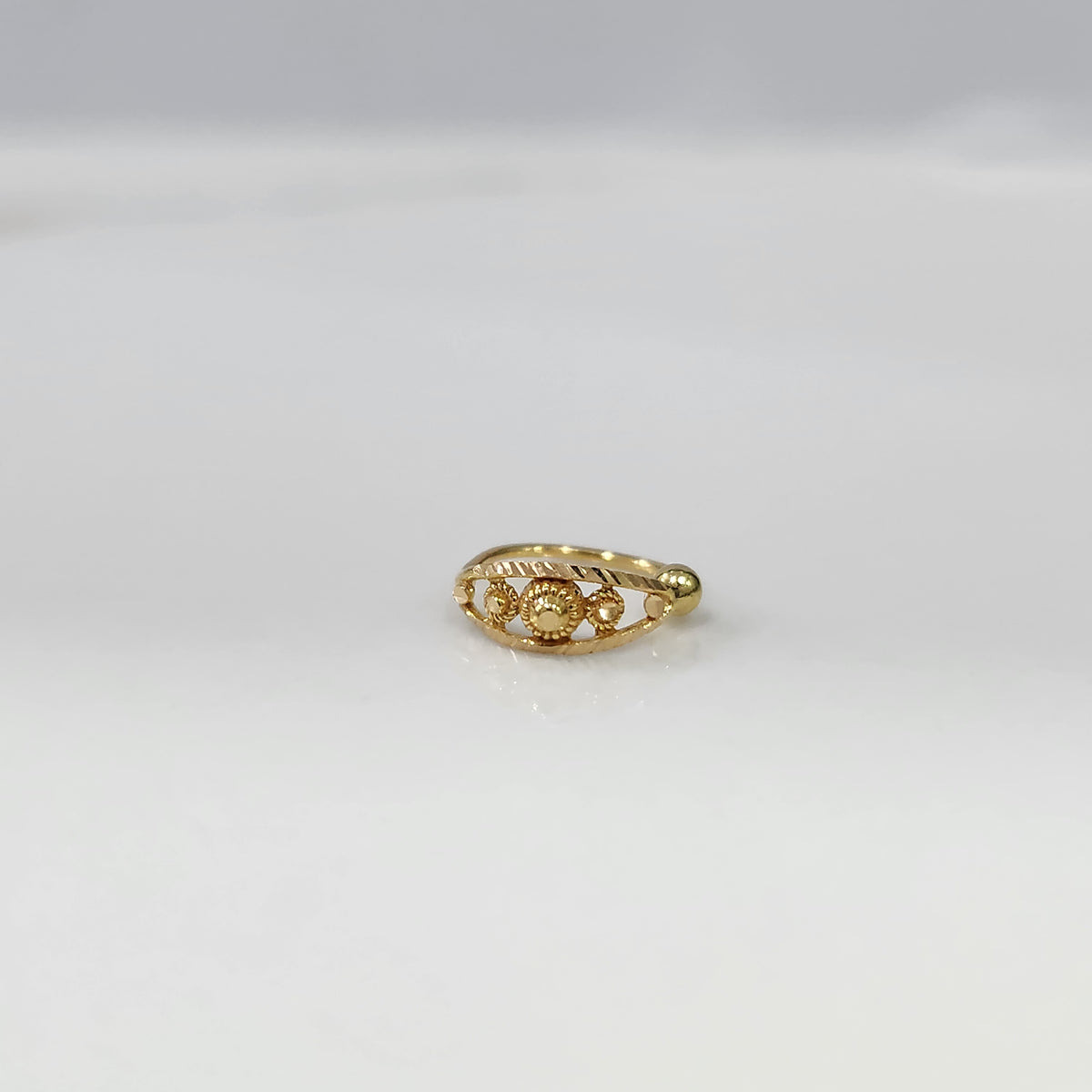 Golden Mosaic Gold Nose Ring by Yuvora in 18K gold, flat-lay display highlighting intricate filigree design with sun-inspired motif