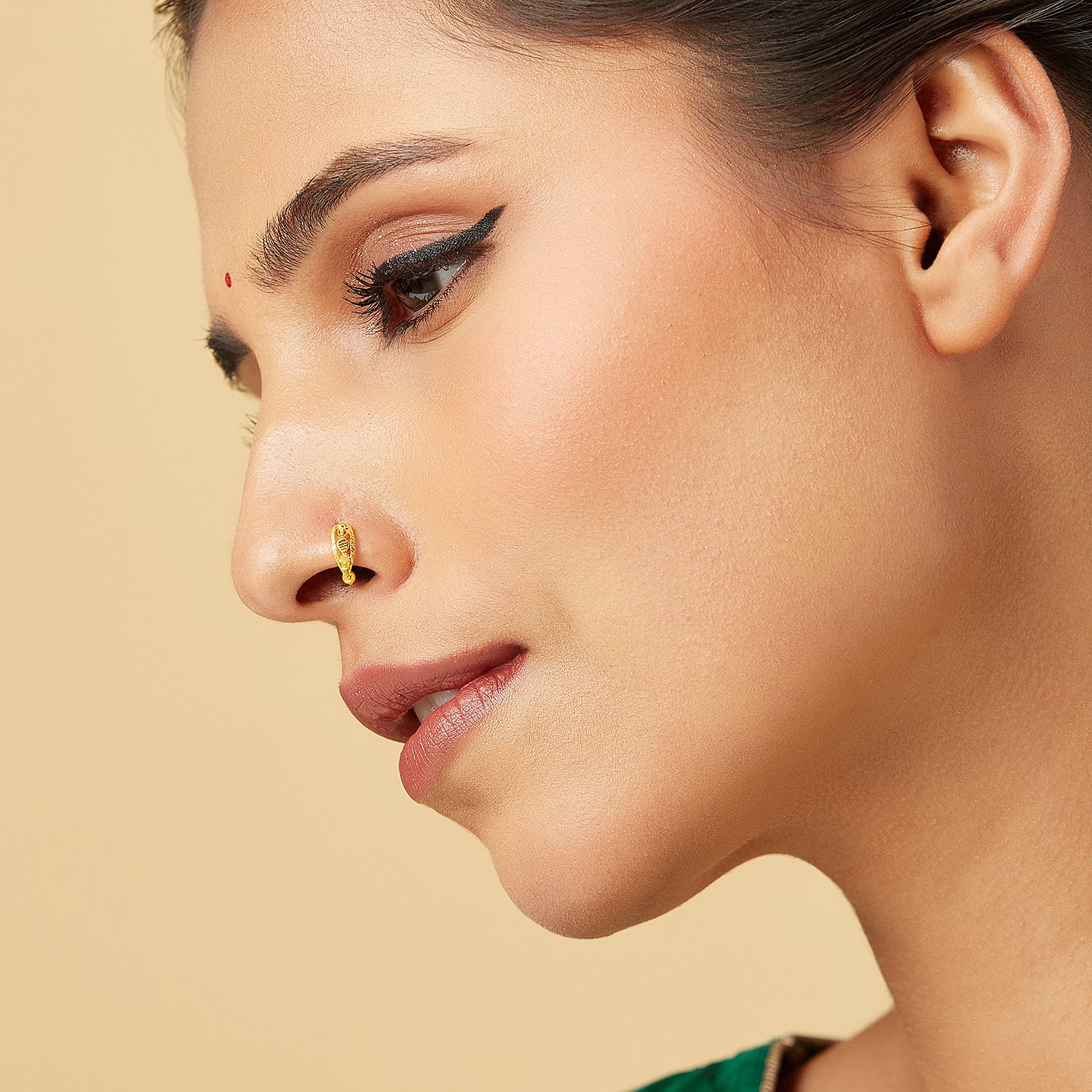 Model wearing Golden Orbit Gold Nose Ring by Yuvora in 18K gold with cosmic-inspired geometric design, elegant jewellery for women