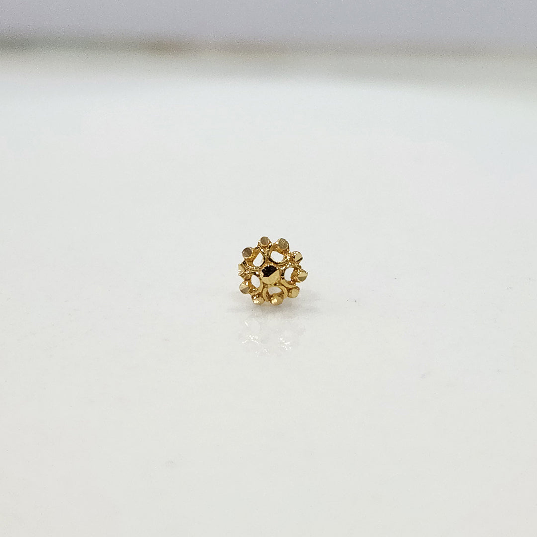 Petal Dome gold nose pin 18K close-up view with floral dome design on plain background