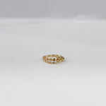 Petite Garland Gold Nose Ring crafted in 18K gold with delicate floral garland design displayed on a flat lay surface by Yuvora