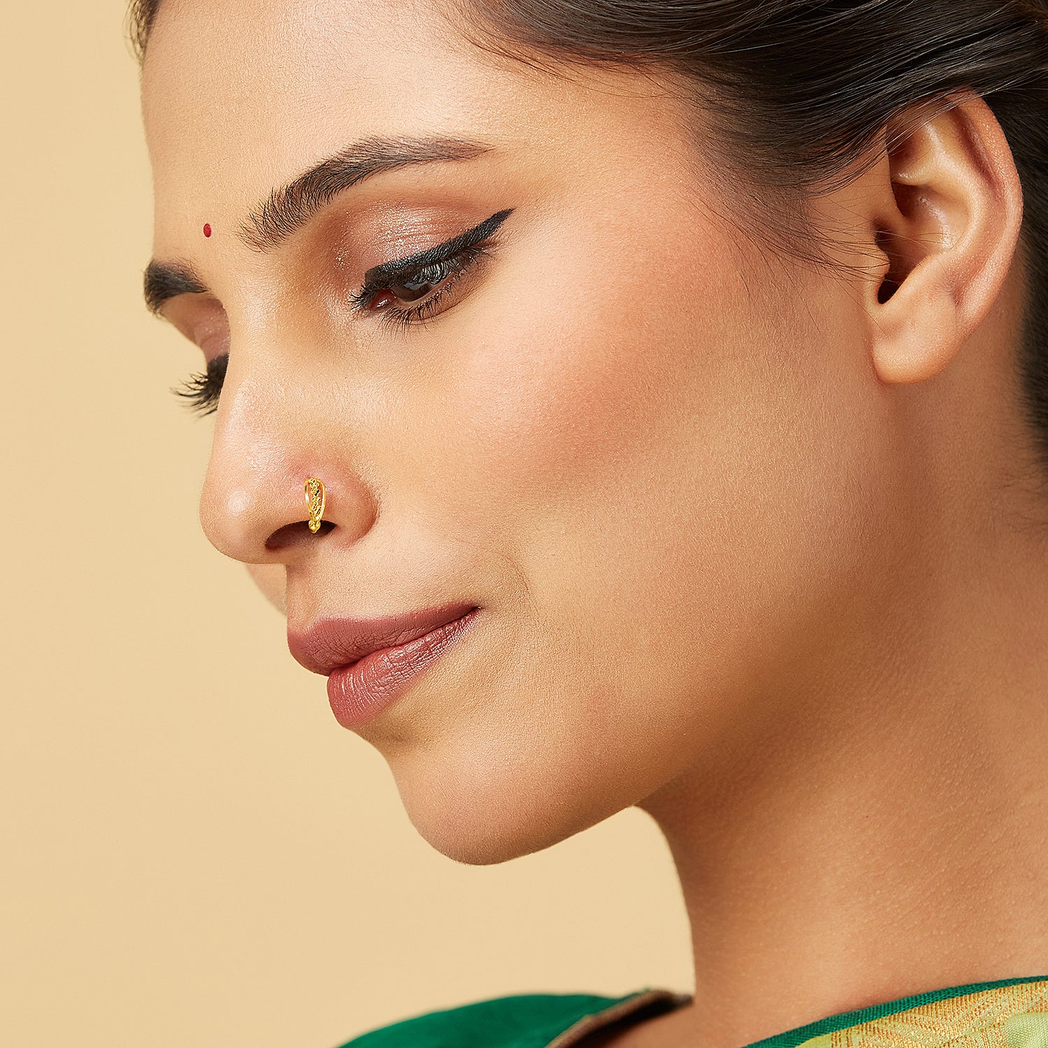 Model wearing Petite Garland Gold Nose Ring in 18K gold with delicate floral design by Yuvora