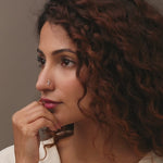 Nose pin gold worn on the nose in a close-up portrait, highlighting a stylish and elegant everyday jewelry look