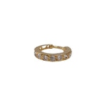Regalia Aura gold nose ring with sparkling white stones shown in side view on a plain background